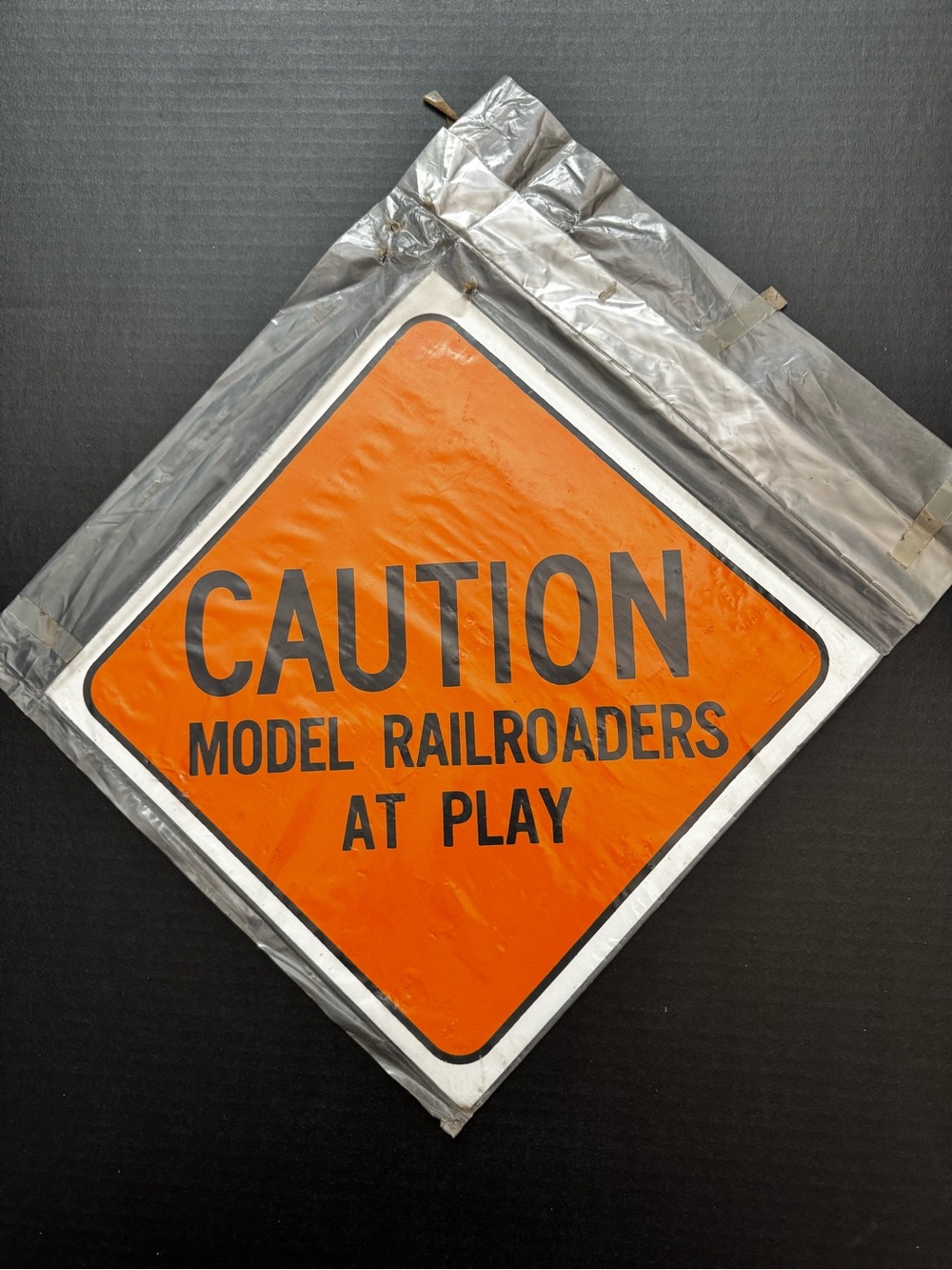 VTG cardboard sign, Caution Model Railroaders  At Play, STORAGE WEAR